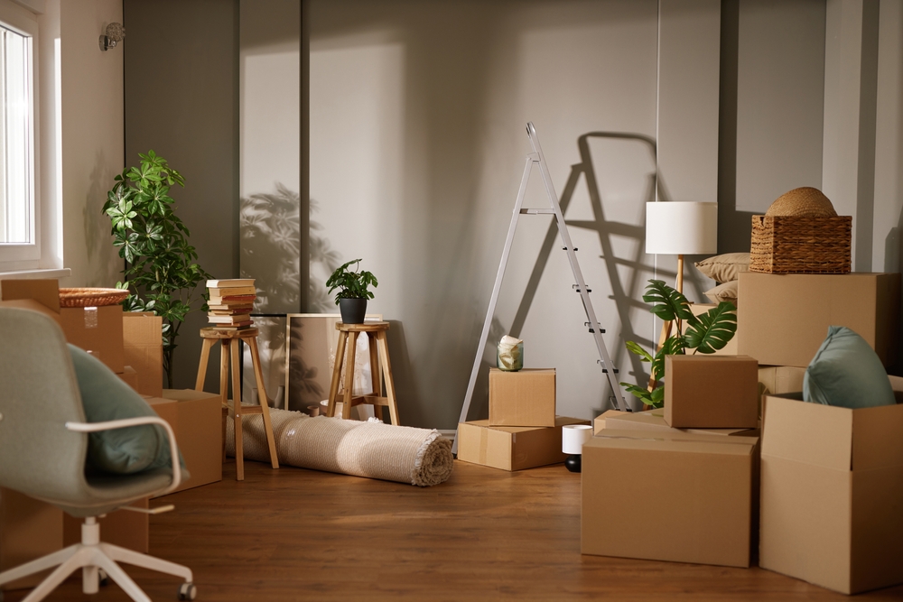 A,Cozy,Room,Filled,With,Unpacked,Boxes,,Stools,,And,A